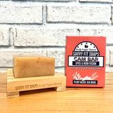 A box of Savvy Fit Soaps Cam Bar in Spice & Herb Fusion with an open soap, highlighting its plant-based, USA-made, and aromatic skincare formula.